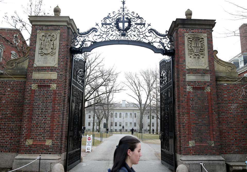 CAMBRIDGE, MA - MARCH 10:  A person walks through Harvard University's campus in Cambridge, MA on March 10, 2020. All Harvard courses will move to remote instruction beginning March 23 as a result of a growing global coronavirus outbreak, University President Lawrence S. Bacow announced in an email Tuesday morning. The University will also ask students not to return from spring break. (Photo by Jonathan Wiggs/The Boston Globe via Getty Images)