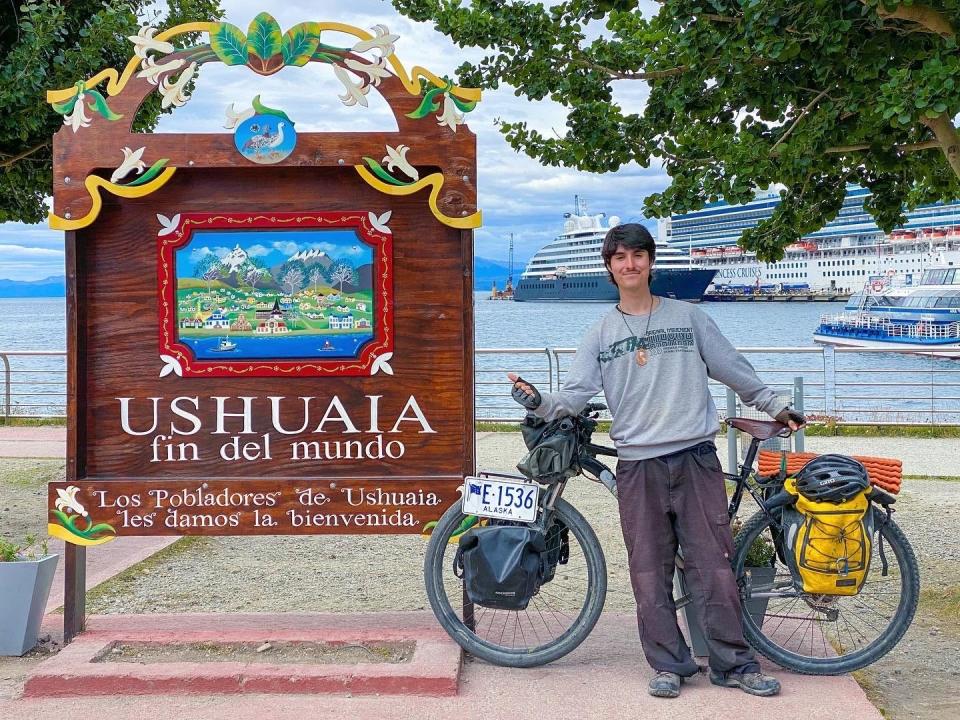 Garner at the ending point of his 20,000-mile-trip, Ushuaia in Argentina.