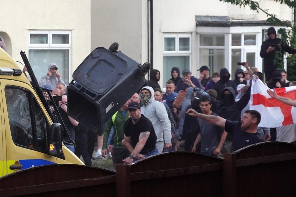 Far-right protesters threw rubbish bins at a police officer in Southport during the disorder (Getty Images)