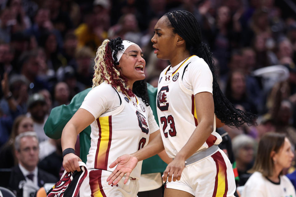 South Carolina's Bree Hall (23) and Te-Hina Paopao react during the NCAA championship game against Iowa on Sunday in Cleveland, Ohio. (Photo by Gregory Shamus/Getty Images)