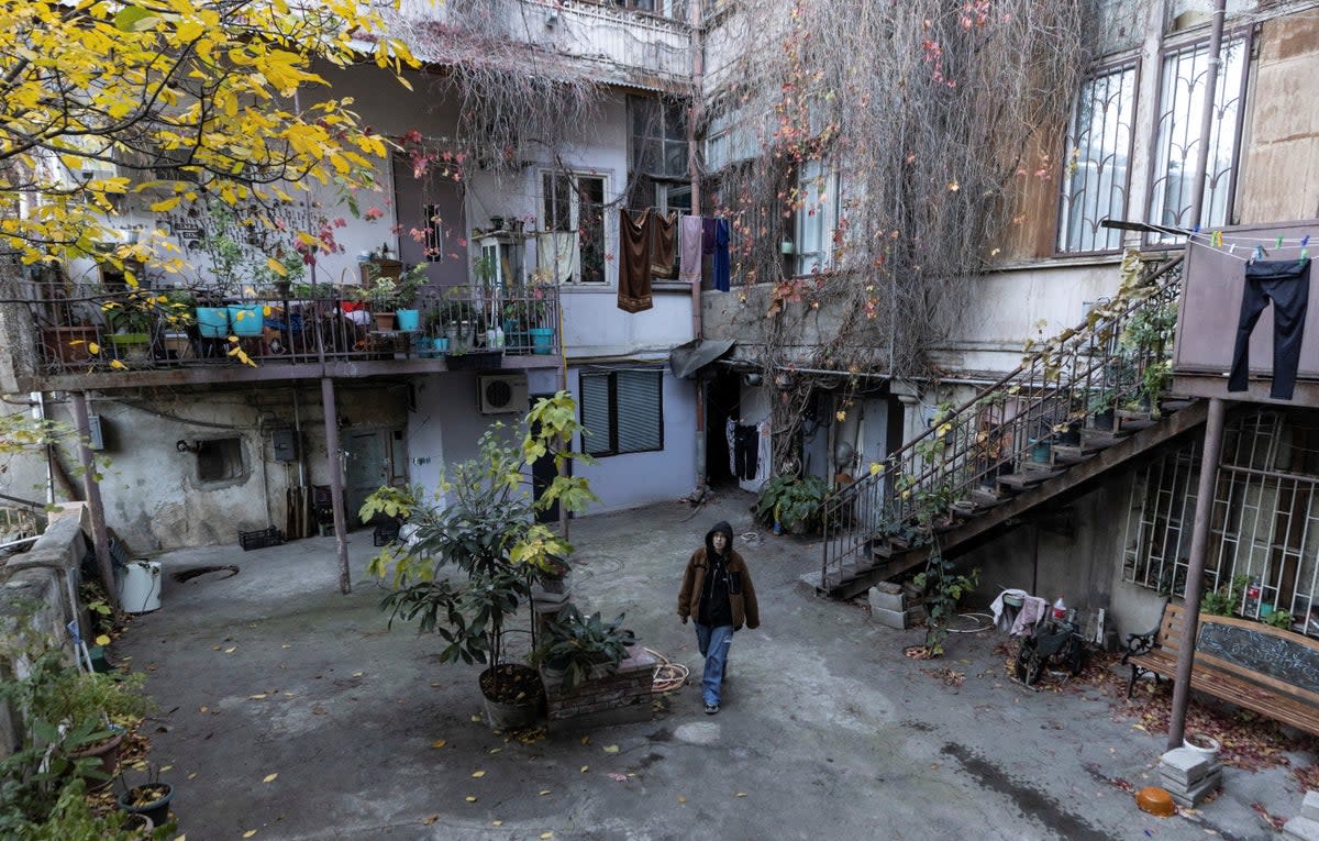 Anastasia Ivanova, 22, a Russian singer also known as Grechka, walks in the centre of Tbilisi (Reuters)