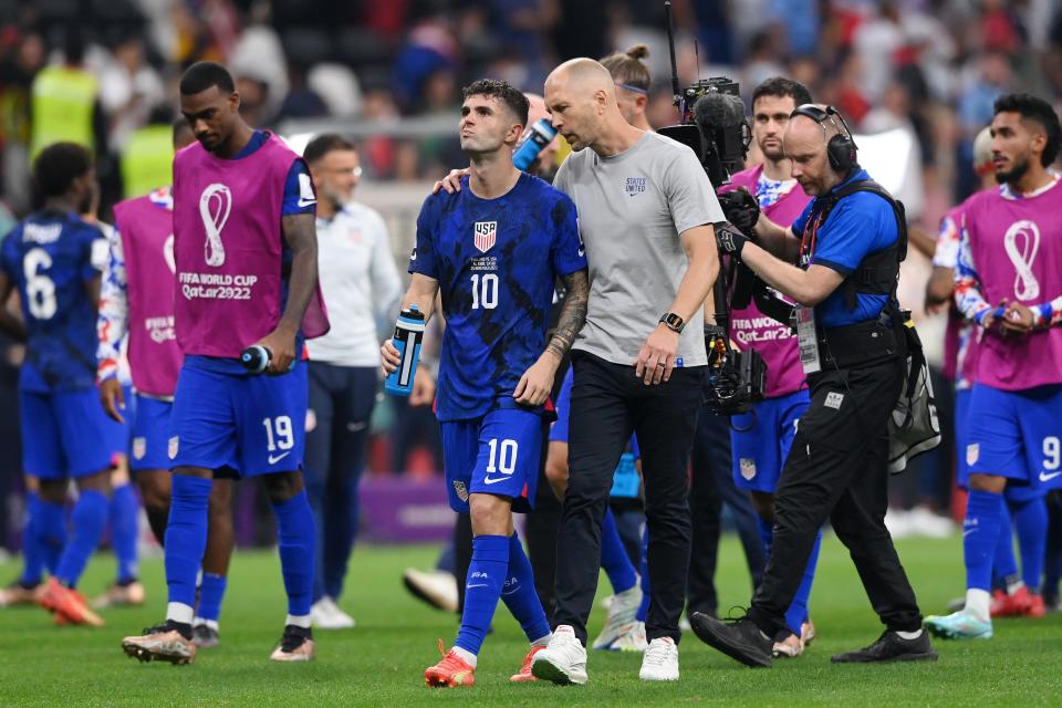 Gregg Berhalter, Head Coach of United States, speaks with Christian Pulisic after the 0-0 draw during the FIFA World Cup Qatar 2022 Group B match between England and USA at Al Bayt Stadium on November 25, 2022 in Al Khor, Qatar.
