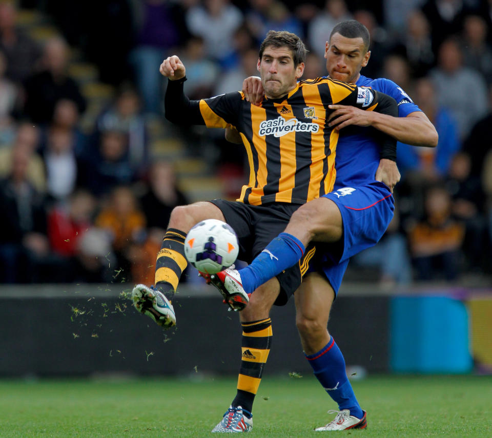 Hull City's Danny Graham (left) and Cardiff City's Steven Caulker during the Barclays Premier League match at the KC Stadium, Hull.