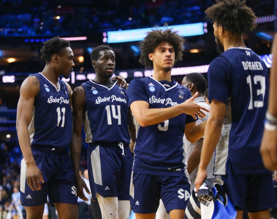 Saint Peter's (from left) KC Ndefo, Hassan Drame and Daryl Banks III come off the floor late in the second half.