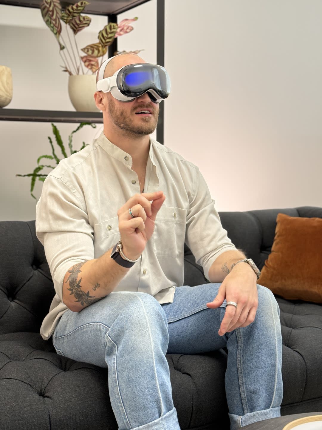 a person wearing sunglasses and sitting on a couch