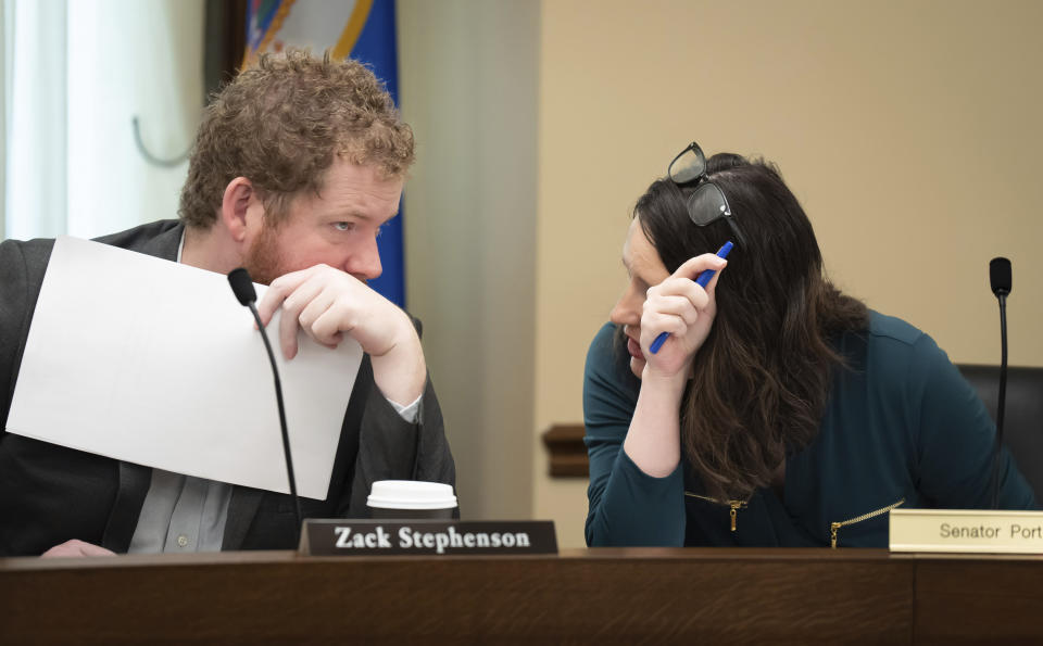 FILE - House and Senate cannabis bill authors Rep. Zack Stephenson and Sen. Lindsey Port confer before the start of the final committee conference on the cannabis bill on May 16, 2023, in St. Paul, Minn. Senators in Minnesota passed a bill Saturday, May 20, 2023, that would legalize recreational marijuana for people over the age of 21, making it the 23rd state to legalize adult-use cannabis. The measure has already been approved by the House and now goes to Democratic Gov. Tim Walz, who has pledged to sign it into law. (Glen Stubbe/Star Tribune via AP, File)