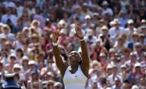 Serena Williams of the U.S.A celebrates after winning her Women's Final match against Garbine Muguruza of Spain at the Wimbledon Tennis Championships in London, July 11, 2015. REUTERS/Toby Melville
