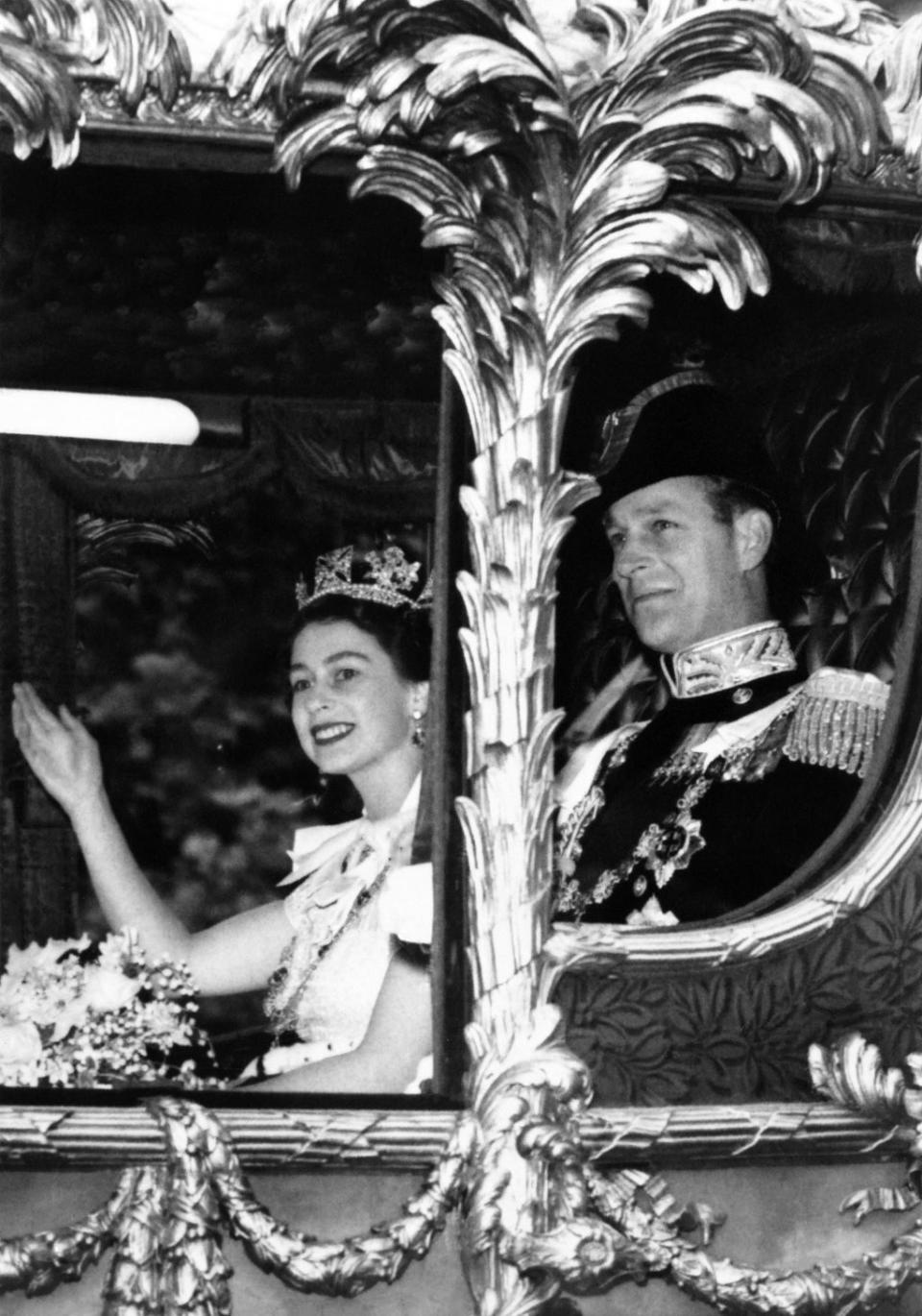 The Queen and Prince Philip in the horse-drawn carriage on the way to Westminster Abbey on 2 June 1953 (INTERCONTINENTALE/AFP via Getty)