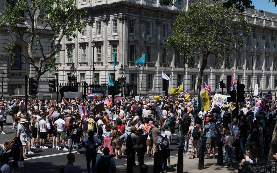 Demonstrators protest outside Downing Street against the delay in easing of lockdown restrictions on June 14, 2021 in London, England. British Prime Minister Boris Johnson expected to announce today a delay of up to four weeks to lifting of Englands Covid-19 restrictions in an effort to tackle the rise of infections caused by the Delta variant of the coronavirus, which now accounts for more than 90% of new cases in the UK. - Getty Images