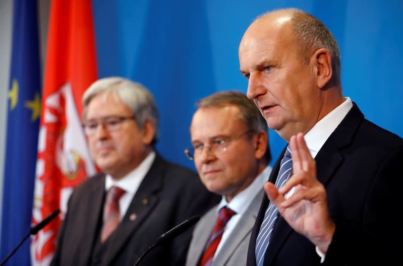 Brandenburg's Prime Minister Dietmar Woidke, state Minister for Economy and Energy Joerg Steinbach and head of the district Oder-Spree authority Rolf Lindemann address media on Tesla European factory in Potsdam