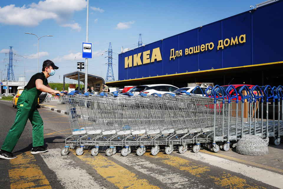 Image: An employee stacks shopping carts outside an Ikea store in Moscow on June 9, 2020. (Andrey Rudakov / Bloomberg via Getty Images file)