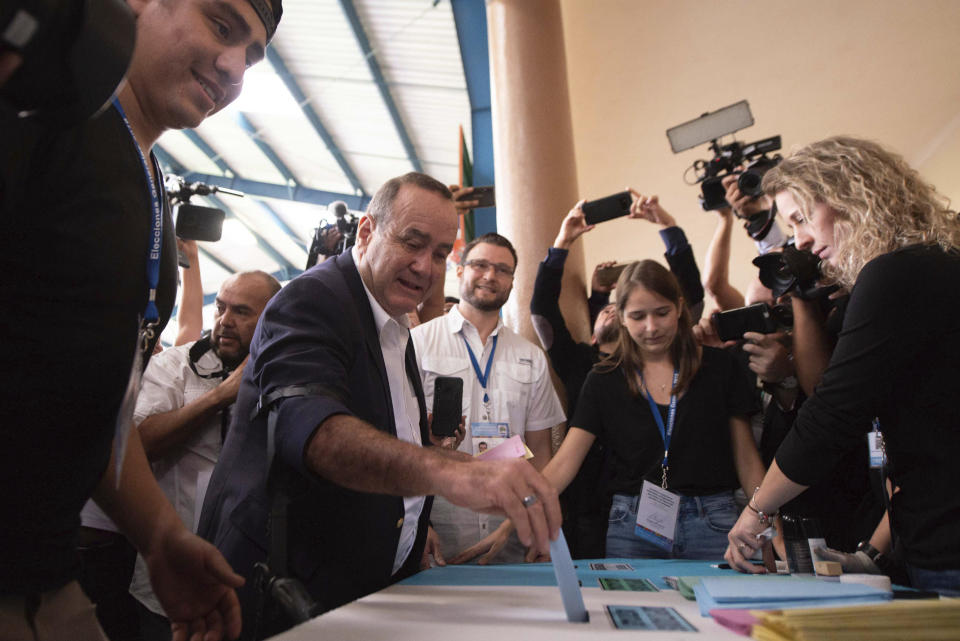 Alejandro Giammattei, presidential candidate of the Vamos party, casts his vote during general elections in Guatemala City, Sunday, June 16, 2019. Guatemalans vote for their next president Sunday in elections plagued by widespread disillusion and distrust, and as thousands of their compatriots flee poverty and gang violence to seek a new life in the United States. (AP Photo/Santiago Billy)