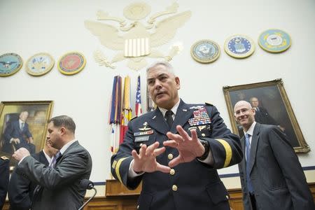 U.S. Army General John Campbell (C), commander of U.S. forces in Afghanistan, prepares to testify before House Armed Services Committee hearing on "U.S. Strategy in Afghanistan" on Capitol Hill in Washington October 8, 2015. REUTERS/Joshua Roberts