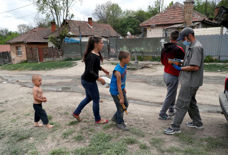 FILE PHOTO: A Roma family arrives to receive a food donation in a deprived neighbourhood during the coronavirus outbreak in Miskolc, Hungary