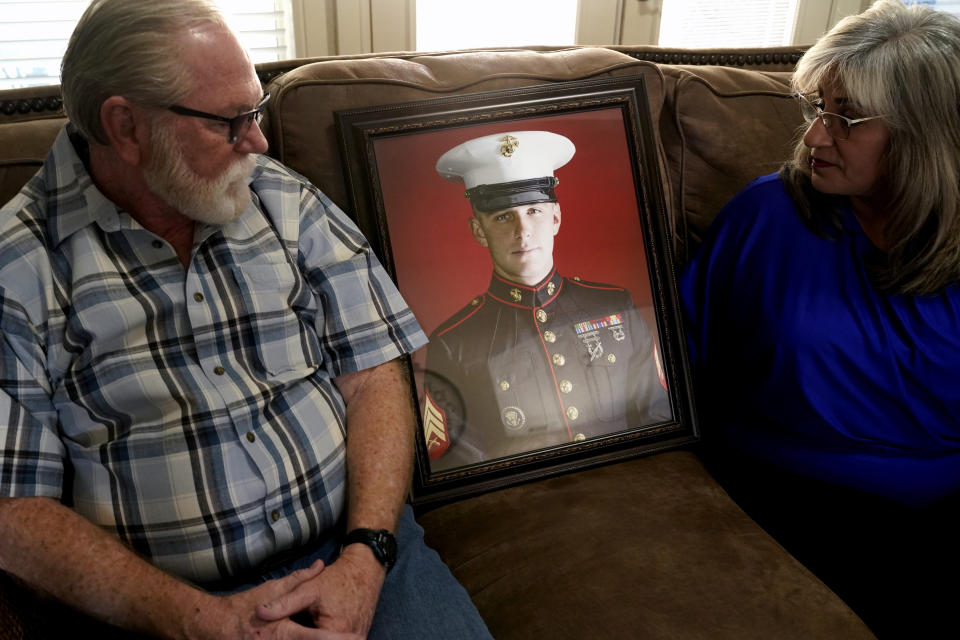 Joey and Paula Reed look at a portrait of their son Marine veteran and Russian prisoner Trevor Reed at their home in Fort Worth, Texas, Tuesday, Feb. 15, 2022. Russia is holding Trevor Reed, who was sentenced to nine years on charges he assaulted a police officer. (AP Photo/LM Otero)