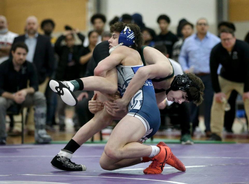 Scituate's Gabriel Boyssou gets the upper hand on Jason Hood of Ponaganset in the 138-pound final at Sunday's state meet. Boyssou went on to win the division 13-4.