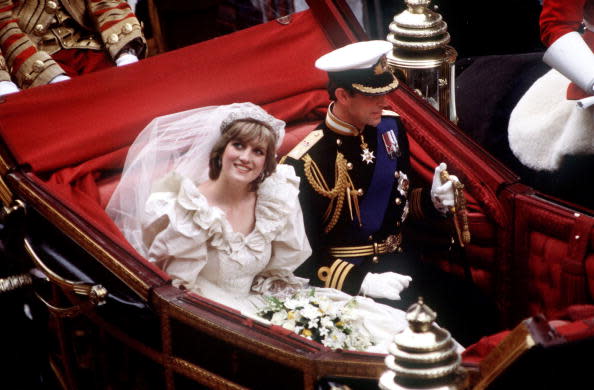 <div class="inline-image__caption"><p>The Prince and Princess of Wales return to Buckingham Palace by carriage after their wedding, on July 29, 1981. Diana wears a wedding dress by David and Elizabeth Emmanuel and the Spencer family tiara.</p></div> <div class="inline-image__credit">Princess Diana Archive/Getty</div>