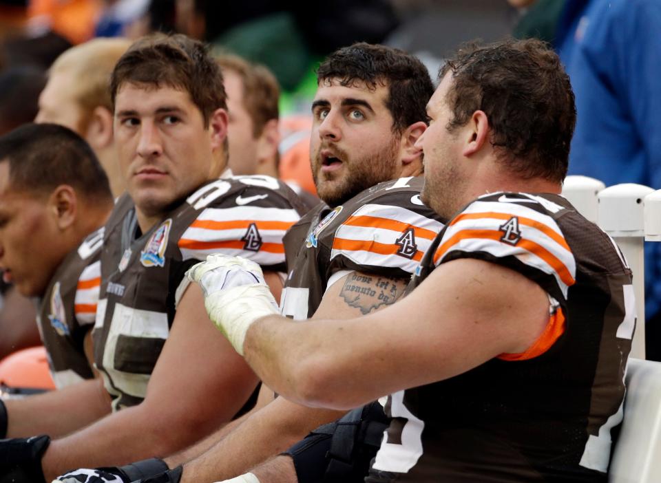 Browns offensive tackle Joe Thomas, right, talks with center Alex Mack, left, and guard John Greco on the bench against the Kansas City Chiefs, Dec. 9, 2012, in Cleveland.