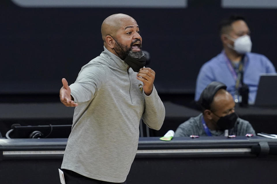 Cleveland Cavaliers coach J. B. Bickerstaff gestures to players during the first half of the team's NBA basketball game against the Sacramento Kings in Sacramento, Calif., Saturday, March 27, 2021. (AP Photo/Jeff Chiu)