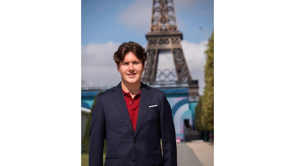 Crown Prince Christian standing in front of Eiffel Tower at Paris 2024 Paralympics