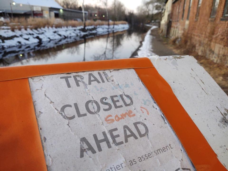 A sign in Lambertville says the trail is closed. But will everyone follow what the sign says?