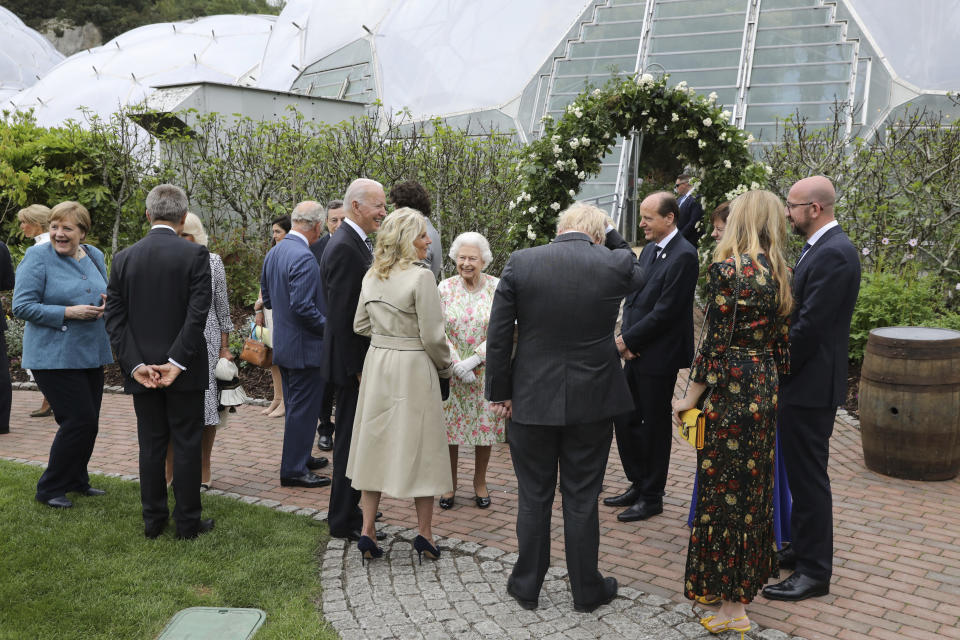 Britain's Queen Elizabeth II speaks to US President Joe Biden and his wife Jill Biden during a reception with the G7 leaders at the Eden Project in Cornwall, England, Friday June 11, 2021, during the G7 summit. (Jack Hill/Pool via AP)