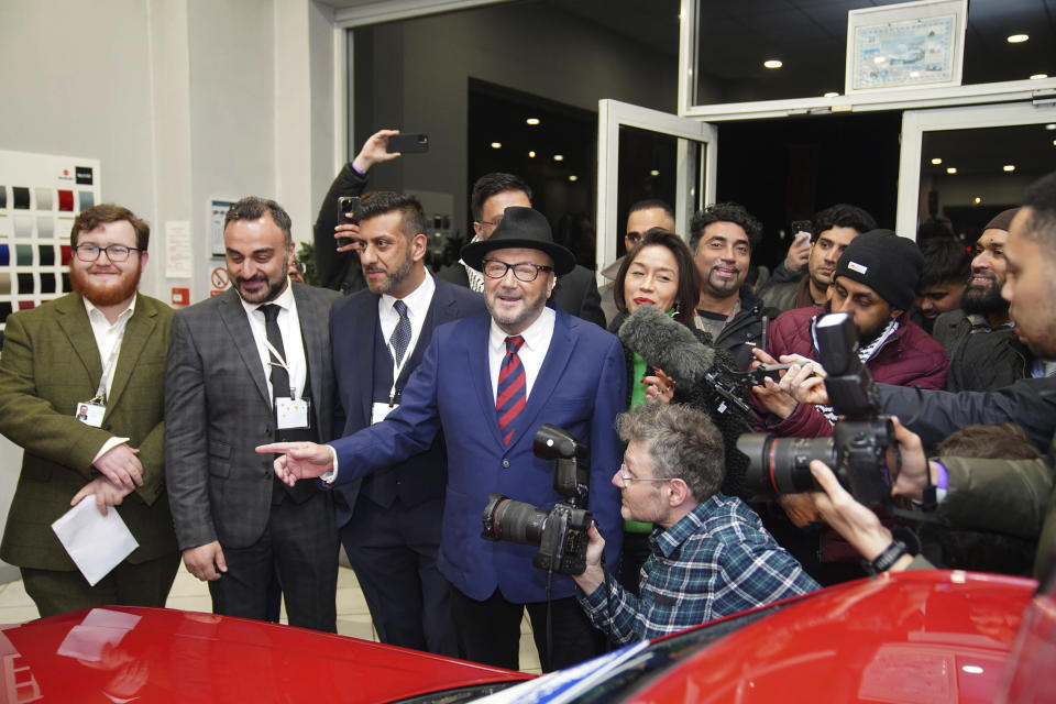 George Galloway, center, holds a rally at his Rochdale headquarters after being declared winner of the Rochdale by-election, which was triggered after the death of Labour Party's member of parliament Tony Lloyd, in Rochdale, England, Thursday, Feb. 29, 2024. (Peter Byrne/PA via AP)