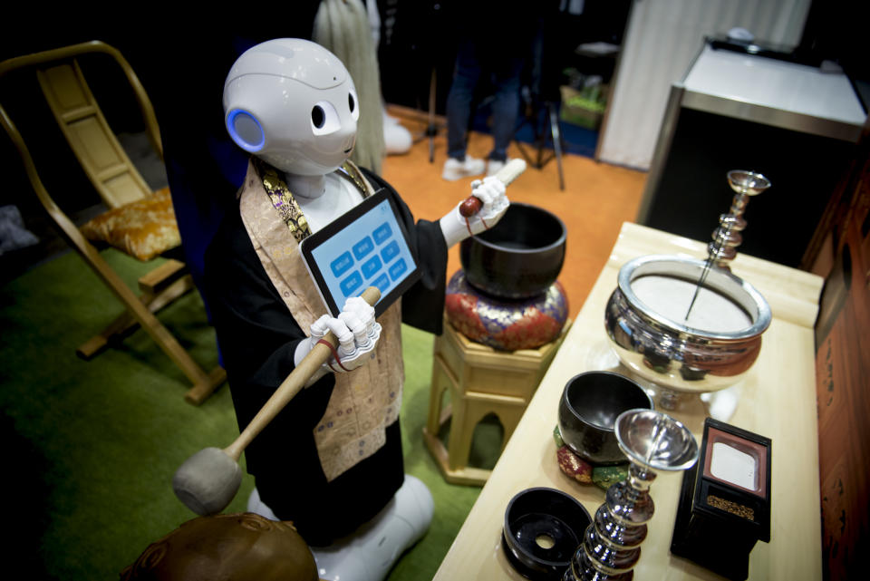 Pepper human-shaped robot while celebrating the Buddhist funeral rites to the Tokyo Int'l Funeral & Cemetery Show in Tokyo August 23, 2017. Hundreds of funeral home operators, cemeteries operators, crematorium operators, traders, suppliers, buyers, professional associations and investors gather at this professional funeral event in Japan.  (Photo by Alessandro Di Ciommo/NurPhoto via Getty Images)
