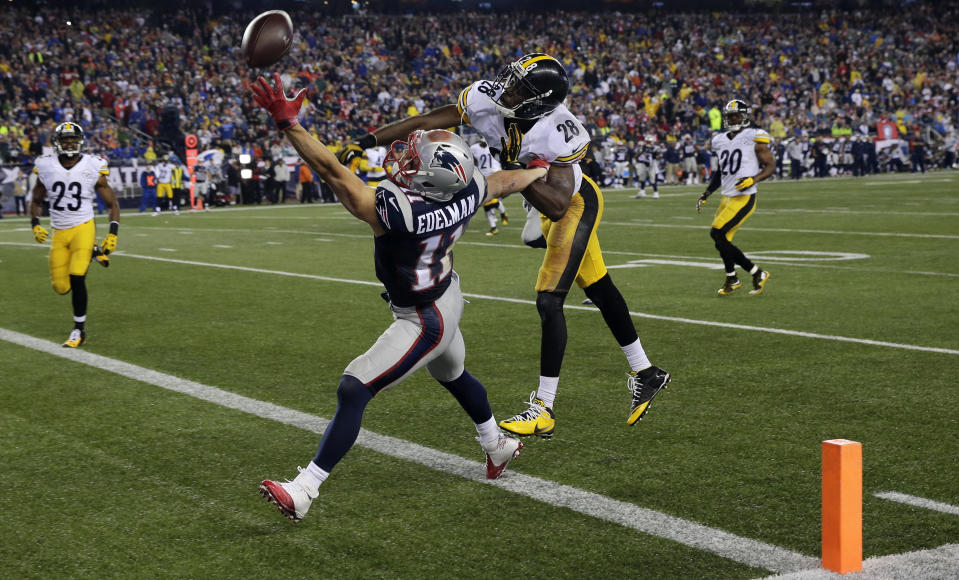 FILE - In this Sept. 10, 2015, file photo, New England Patriots wide receiver Julian Edelman (11) cannot catch a pass in the end zone as Pittsburgh Steelers cornerback Cortez Allen (28) defends in the second half of an NFL football game in Foxborough, Mass. Citing a knee injury that cut his 2020 season short after just six games, Edelman announced Monday, April 12, 2021, that he is retiring from the NFL after 11 seasons. (AP Photo/Charles Krupa, File)