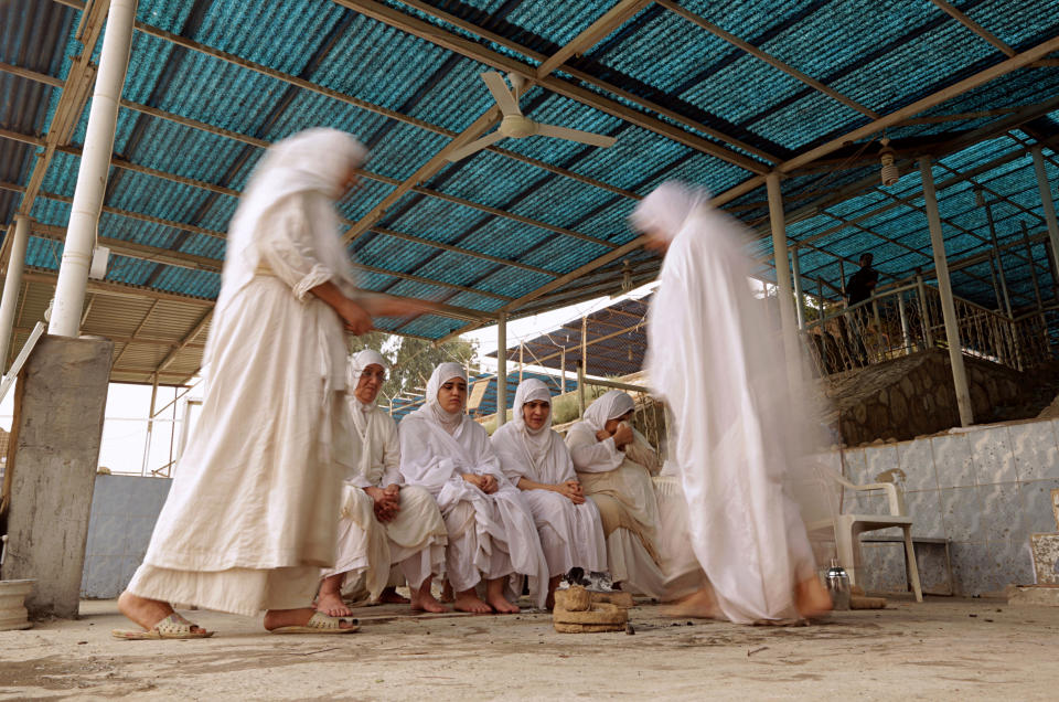 In this Sunday, Oct. 14, 2018 photo, followers of the obscure and ancient Mandaean faith performs rituals along a strip of embankment on the Tigris River reserved for them, in Baghdad, Iraq. Until 2003, nearly all the world’s Mandaeans lived in Iraq, but the cycles of conflict since the U.S. invasion have driven minorities out of the country for security reasons and economic opportunity. (AP Photo/Hadi Mizban)