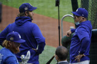 Los Angeles Dodgers manager Dave Roberts talks with starting pitcher Clayton Kershaw during batting practice before Game 2 of the baseball World Series against the Tampa Bay Rays Wednesday, Oct. 21, 2020, in Arlington, Texas. (AP Photo/Sue Ogrocki)