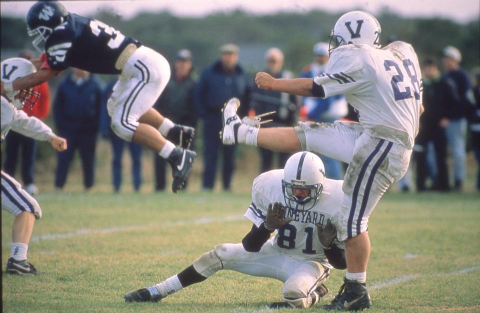 A Martha's Vineyard field goal kicker and a Nantucket defender line up perfectly in an Island Cup gamer played many years ago on Nantucket.