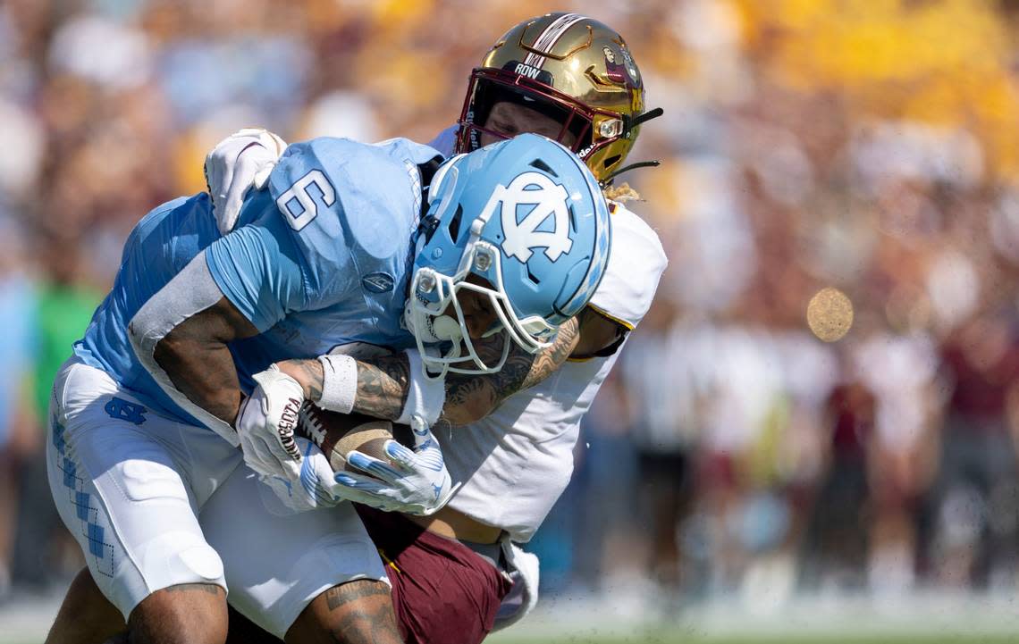North Carolina’s Nate McCollum (6) scores in a 46-yard pass reception from quarterback Drake Maye in the first quarter against Minnesota on Saturday, September 16, 2023 at Kenan Stadium in Chapel Hill N.C.