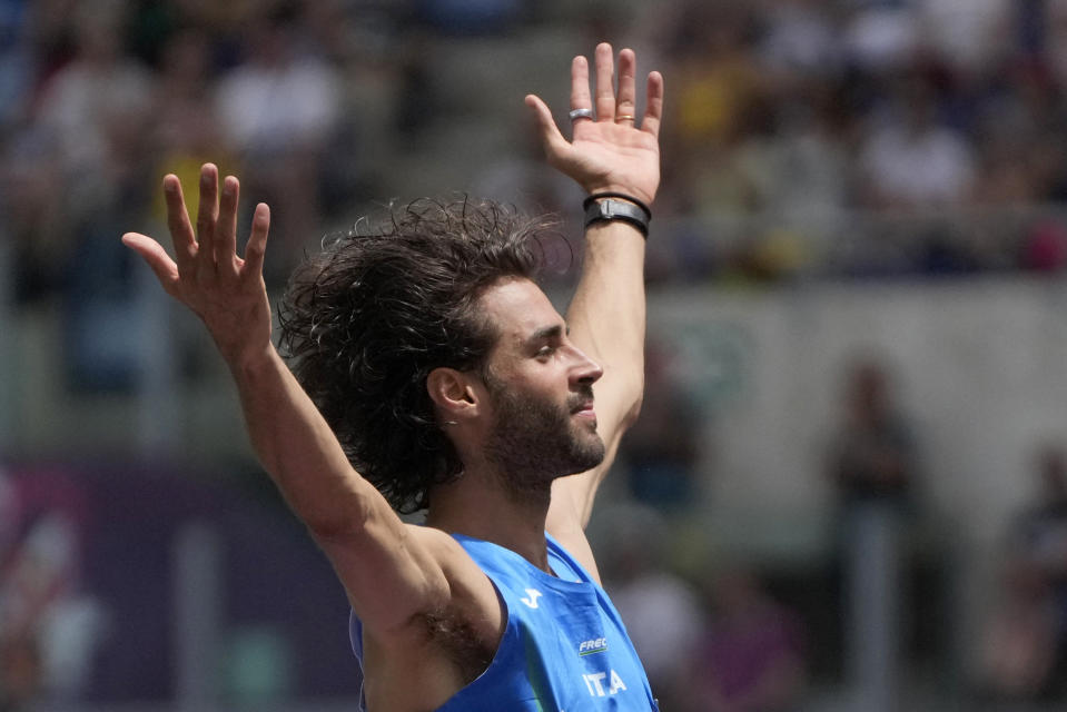 Gianmarco Tamberi, of Italy, reacts after a successful attempt in the men's high jump at the the European Athletics Championships in Rome, Sunday, June 9, 2024. (AP Photo/Gregorio Borgia)