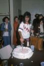 <p>Alice Cooper cuts into a cake backstage at Madison Square Garden after a concert in May, 1975. The rocker was on tour for his 1975 album, <em>Welcome to My Nightmare. </em></p>