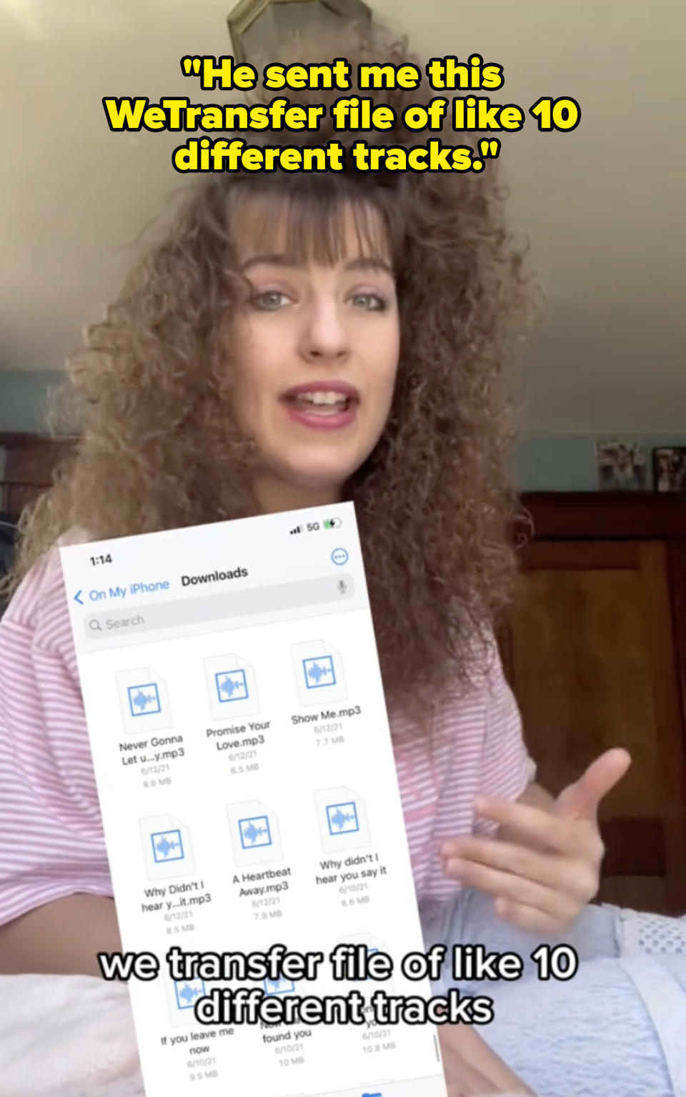 Woman with curly hair discusses transferred audio files on her phone, showing a list of downloaded MP3 tracks, including "Never Gonna Let U.mp3" and "Promise You"