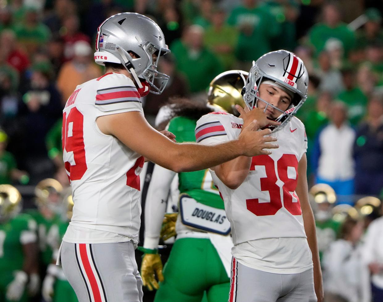 Ohio State Buckeyes kicker Jayden Fielding, right, celebrates a 31-yard field goal against Notre Dame with his holder Jesse Mirco.