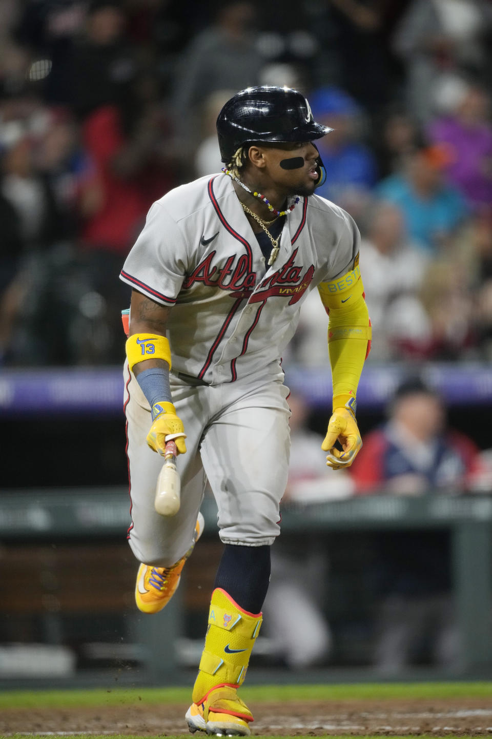 Atlanta Braves' Ronald Acuna Jr. heads up the first base line after connecting for a double to drive in three runs against Colorado Rockies relief pitcher Daniel Bard in the ninth inning of a baseball game Monday, Aug. 28, 2023, in Denver. (AP Photo/David Zalubowski)