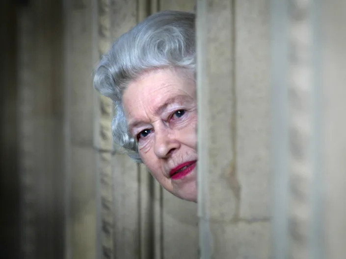 Queen Elizabeth peeks around a corner