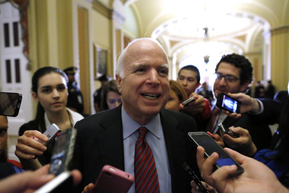 U.S. Senator John McCain (R-AZ) smiles as he talks to reporters after a Republican Senate caucus meeting at the U.S. Capitol in Washington October 16, 2013. The U.S. Senate announced a last-minute deal on Wednesday to avert a historic lapse in the government's borrowing ability and a potentially damaging debt default, and to reopen the government after a two-week shutdown. REUTERS/Jonathan Ernst