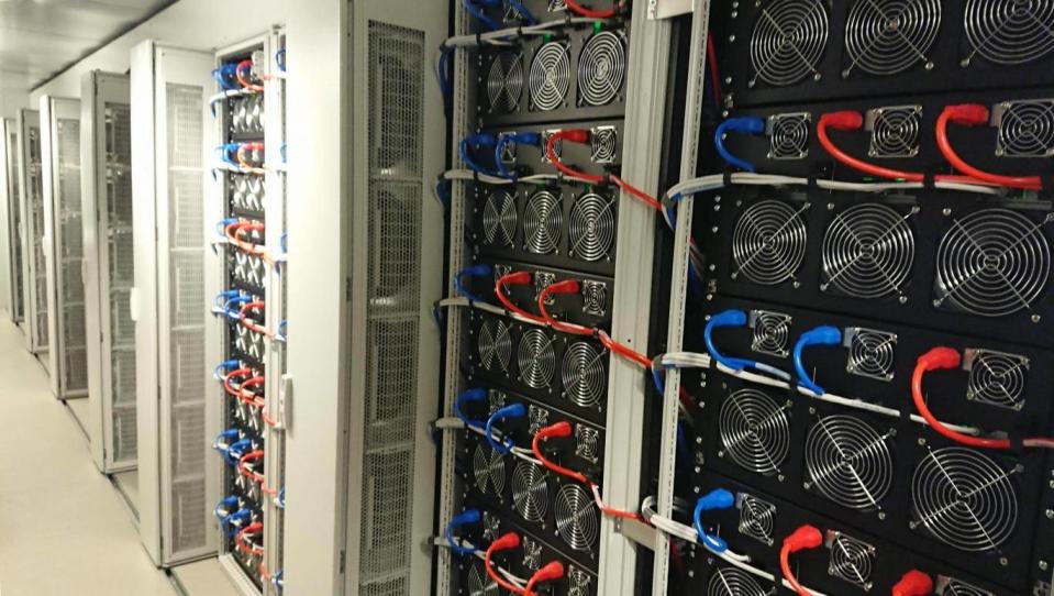 Inside each container are 210 mining rigs that produce thousands of dollars of bitcoin each day (The Independent)