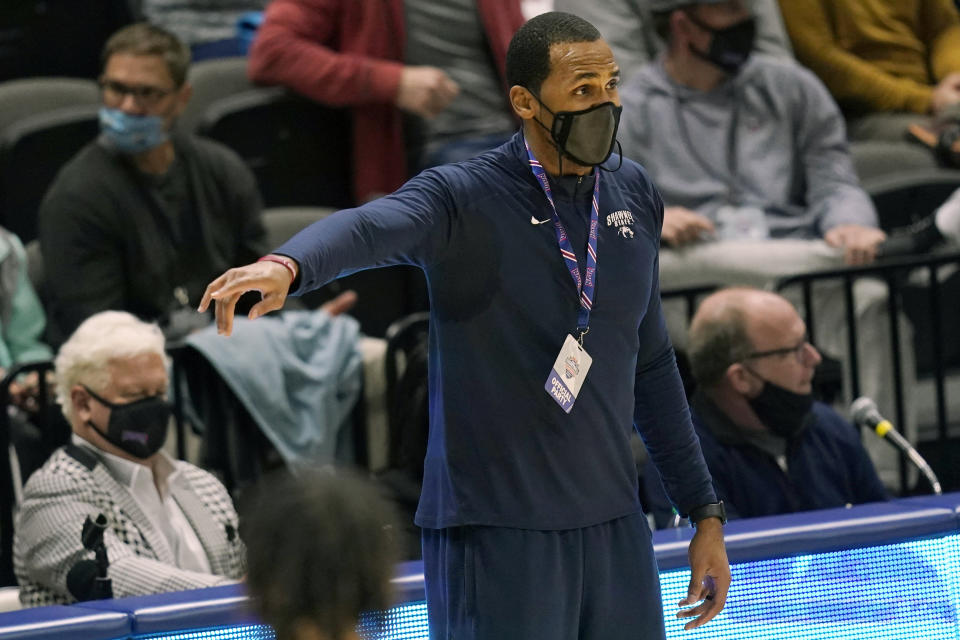 Shawnee State head coach Delano Thomas directs his team during the first half of an NAIA basketball game against Lewis-Clark State in the finals of the national tournament in Kansas City, Mo., Tuesday, March 23, 2021. (AP Photo/Orlin Wagner)