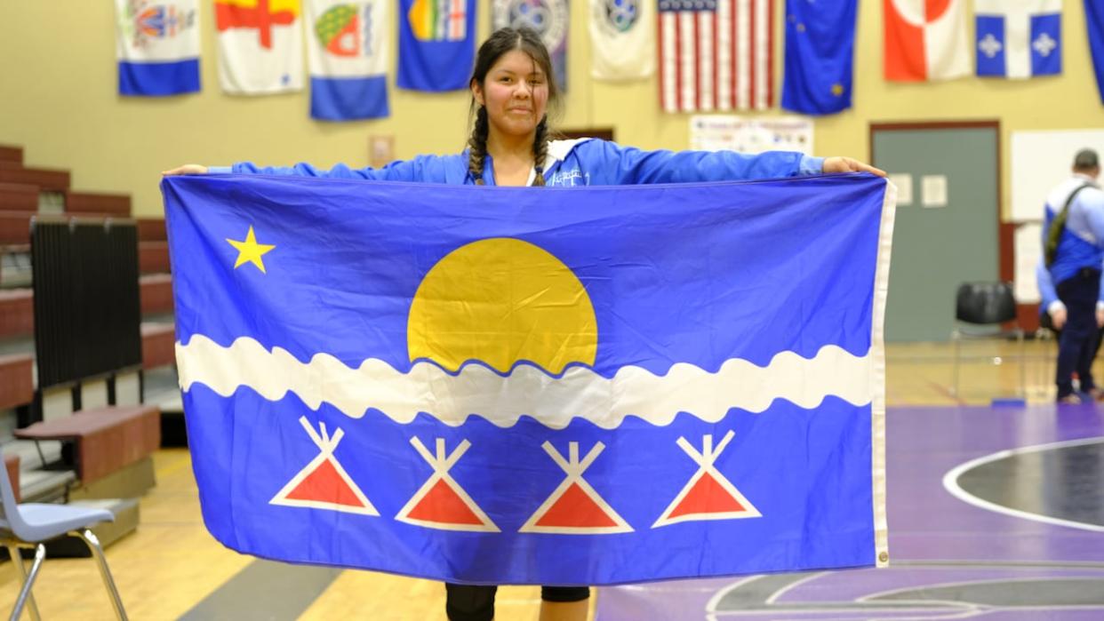 Hannah Bekale, 15, is competing in wrestling at the Arctic Winter Games. She says she's proud of herself for overcoming her shyness, meeting the challenge of travelling to a new place and giving her all on the mat. Mentorship has helped her get there.  (Graham Shishkov/CBC - image credit)