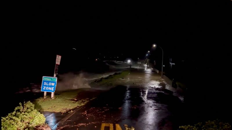 FILE PHOTO: A view shows high tides rising due to Cyclone Gabrielle in Arkles Bay, Auckland