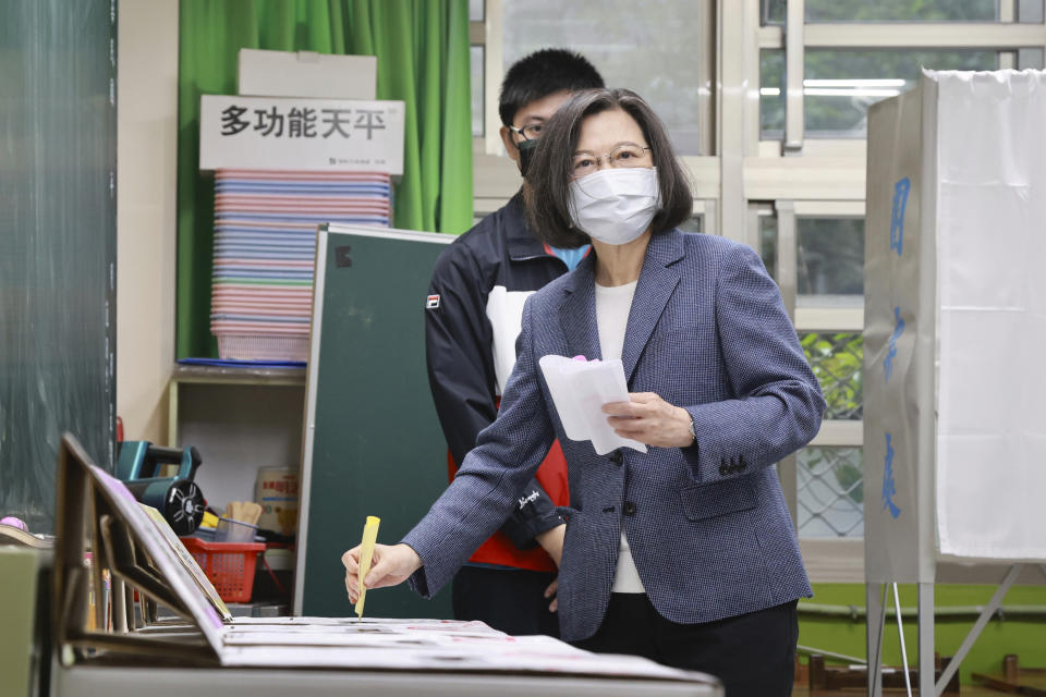 Taiwan President Tsai Ing-wen casts her ballots at a polling station in New Taipei City, Taiwan, Saturday, Nov. 26, 2022. Voters headed to the polls across Taiwan in a closely watched local election Saturday that will determine the strength of the island's major political parties ahead of the 2024 presidential election. (Chang Hao-an/Pool Photo via AP)