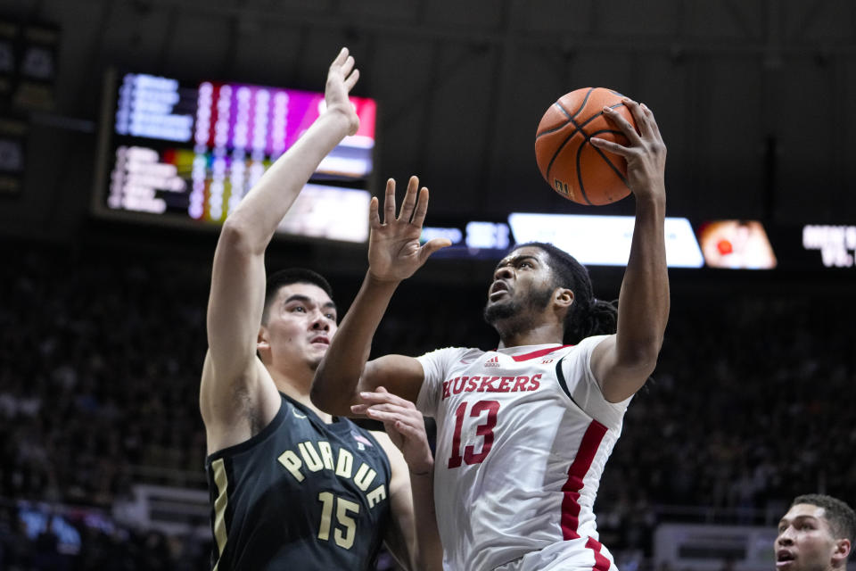 Nebraska forward Derrick Walker (13) shoots over Purdue center Zach Edey (15) during the first half of an NCAA college basketball game in West Lafayette, Ind., Friday, Jan. 13, 2023. (AP Photo/Michael Conroy)