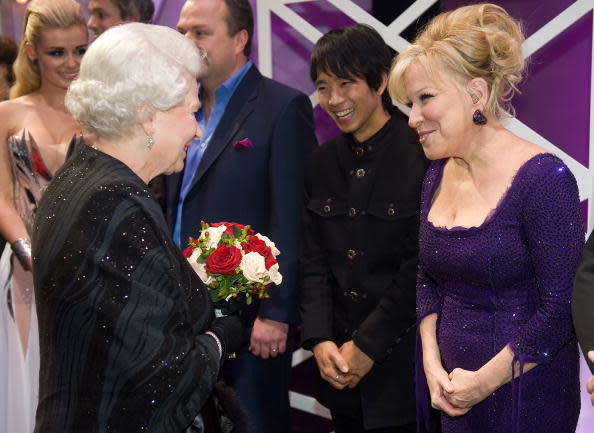 <p>Bette Midler looks absolutely chuffed to bits to meet the Queen. As much as we love her sparkly purple number we think her smile makes the outfit. <i> [Photo: Leon Neal/ WPA Pool /Getty Images]</i></p>