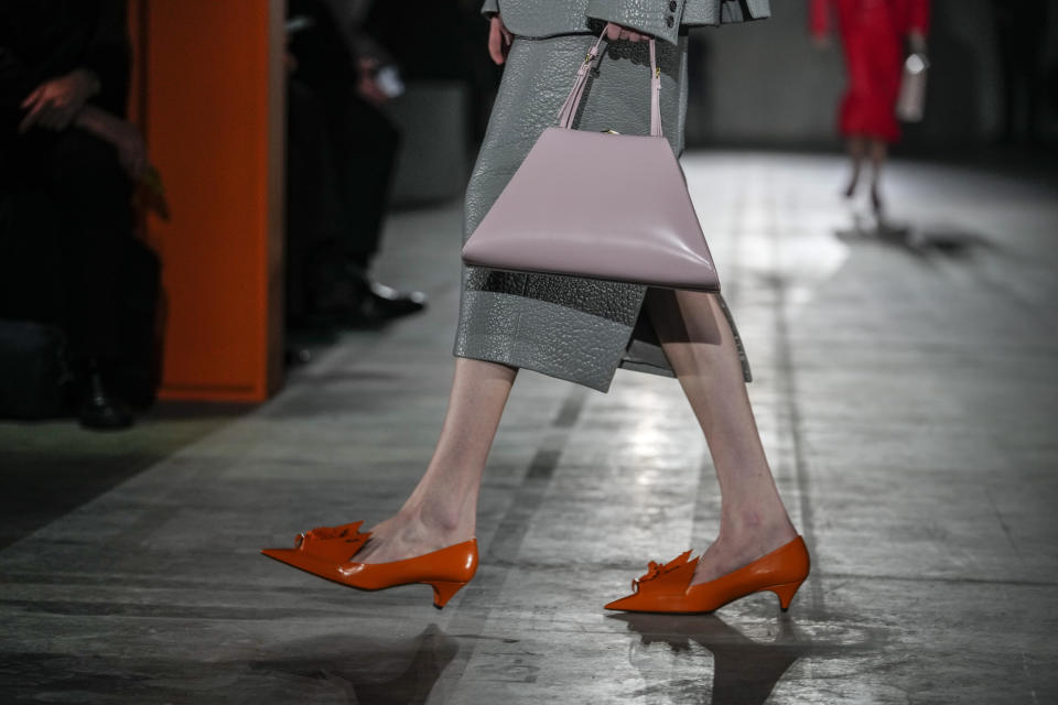 A model wears a creation as part of the Prada women's Fall-Winter 2023-24 collection presented in Milan, Italy, Thursday, Feb. 23, 2023. (AP Photo/Luca Bruno)