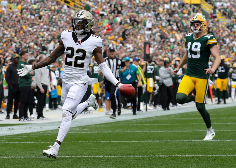 New Orleans Saints wide receiver Rashid Shaheed (22) scores a touchdown on punt against Green Bay Packers punter Daniel Whelan (19) in the second quarter during their football game Sunday, September 24, 2023, at Lambeau Field in Green Bay, Wis.<br>Dan Powers/USA TODAY NETWORK-Wisconsin.