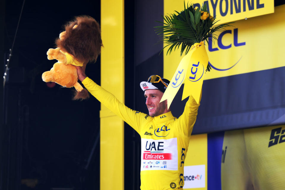 BAYONNE FRANCE  JULY 03 Adam Yates of United Kingdom and UAE Team Emirates celebrates at podium as Yellow leader jersey winner during the stage three of the 110th Tour de France 2023 a 1935km stage from AmorebietaEtxano to Bayonne  UCIWT  on July 03 2023 in Bayonne France Photo by David RamosGetty Images